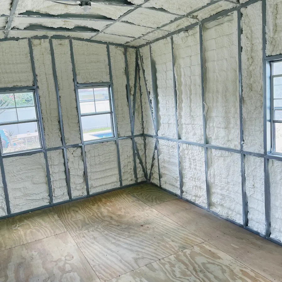 Closed-cell spray foam insulation applied to wall cavities in a residential project in Bronxville